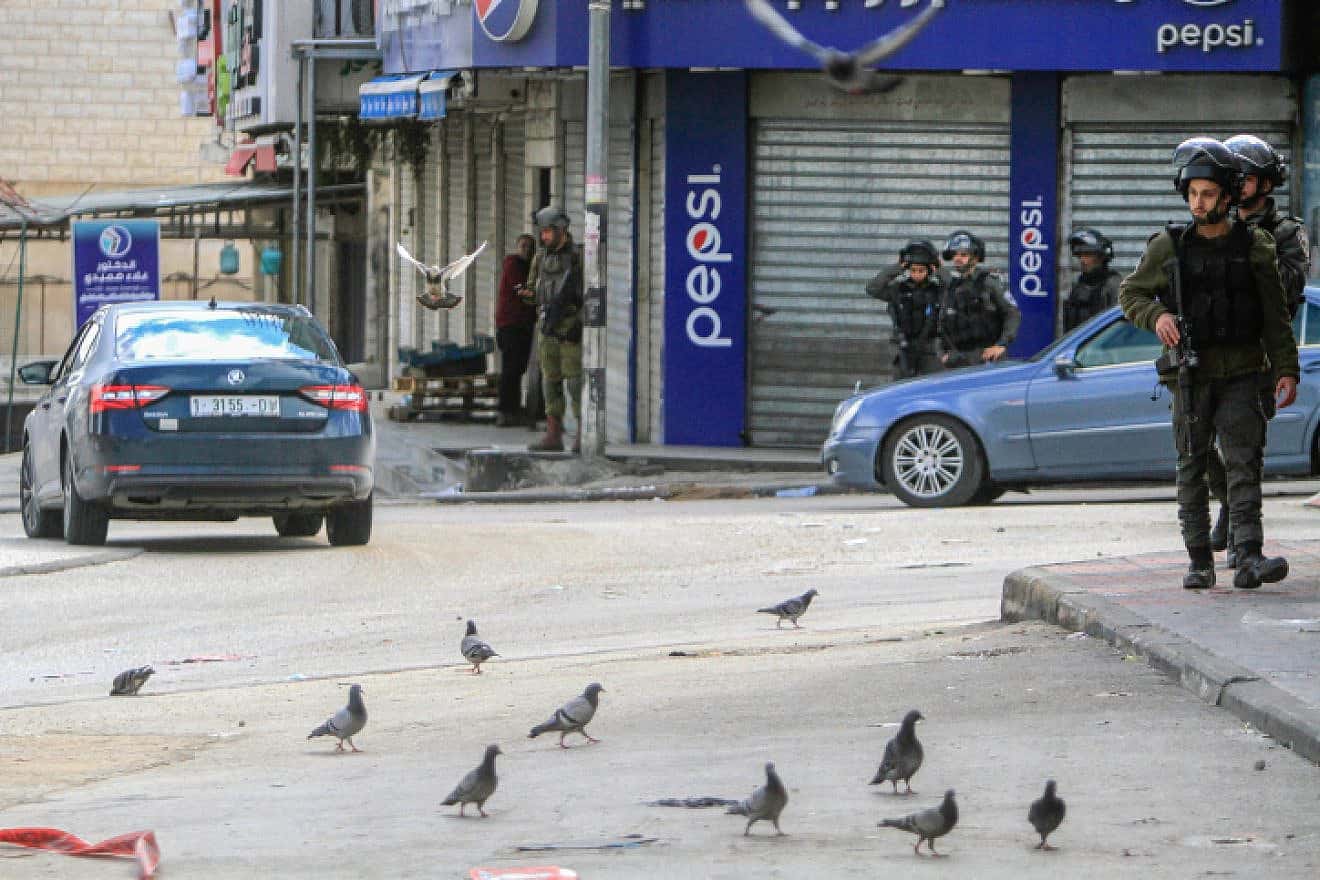 Israeli security forces stand guard in Hawara, Samaria, March 20, 2023. Photo by Nasser Ishtayeh/Flash90.
