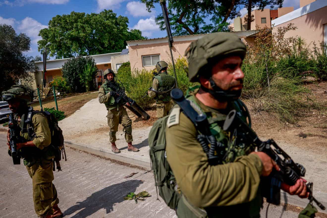 Israeli soldiers in Kibbutz Kfar Aza, near the Israeli-Gaza border in southern Israel, Oct. 10, 2023. Photo by Chaim Goldberg/Flash90.