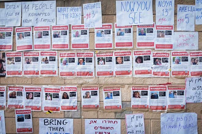 Fliers posted by families of Israelis held hostage by Hamas in the Gaza Strip outside the Israeli Defense Ministry in Tel Aviv, Oct. 14, 2023. Photo by Avshalom Sassoni/Flash90.