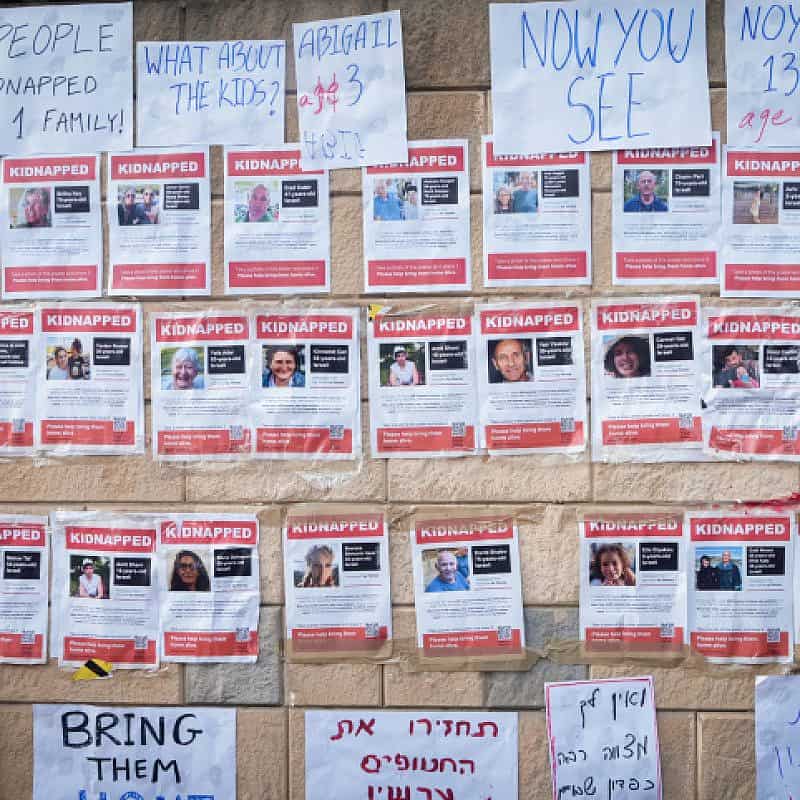 Fliers posted by families of Israelis held hostage by Hamas in the Gaza Strip outside the Israeli Defense Ministry in Tel Aviv, Oct. 14, 2023. Photo by Avshalom Sassoni/Flash90.