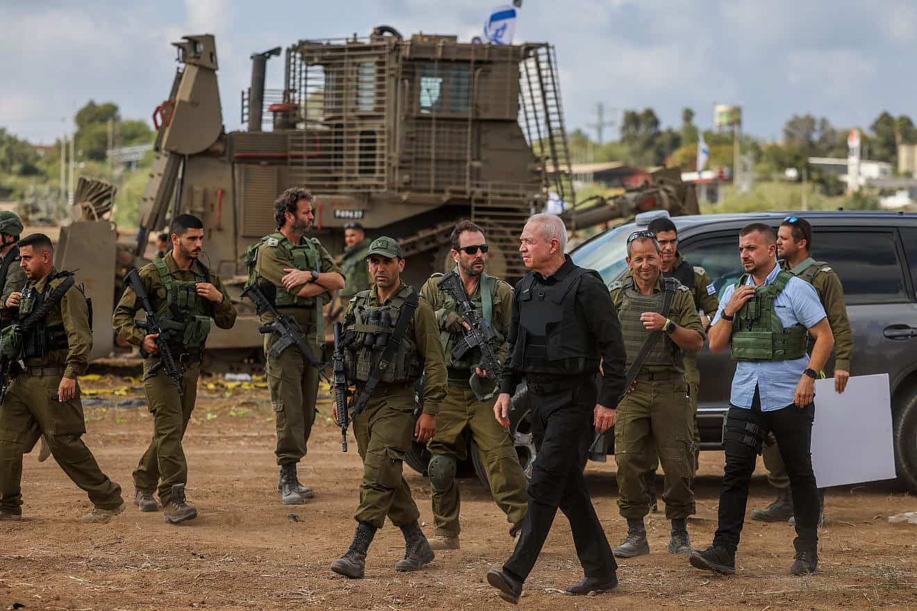Israeli Defense Minister Yoav Gallant speaks with soldiers at a staging area near the Gaza Strip, Oct. 19, 2023. Photo by Chaim Goldberg/Flash90.