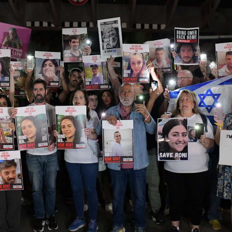 Families of those held hostage by Hamas terrorists in the Gaza Strip hold photos of their loved ones during a protest outside of the Tel Aviv Museum of Art on Oct. 21, 2023. Photo by Tomer Neuberg/Flash90.