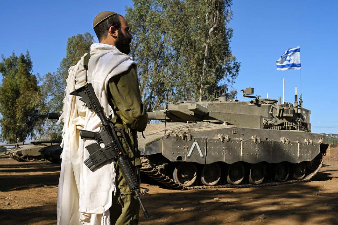 An Israeli soldier recites morning prayers near the border with Lebanon, Oct. 25, 2023. Photo by Michael Giladi/Flash90.