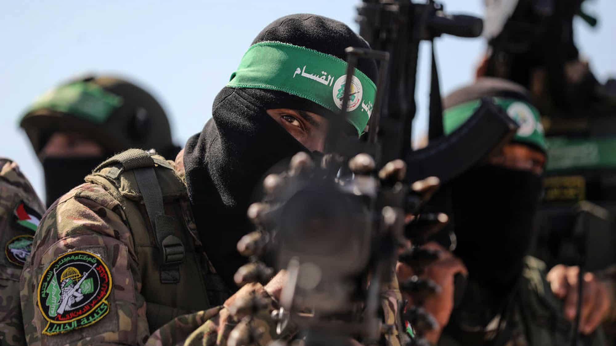 Hamas terrorists march along the border fence between Israel and the Gaza Strip, July 19, 2023. Photo by Majdi Fathi/TPS.