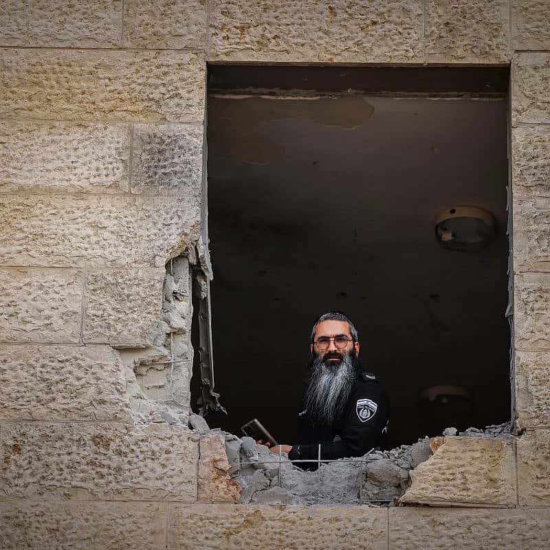 Israeli security forces at the scene where a rocket fired from Hamas the Gaza Strip hit and caused damage in the southern Israeli city of Sderot, Oct. 23, 2023. Photo by Chaim Goldberg/Flash90.