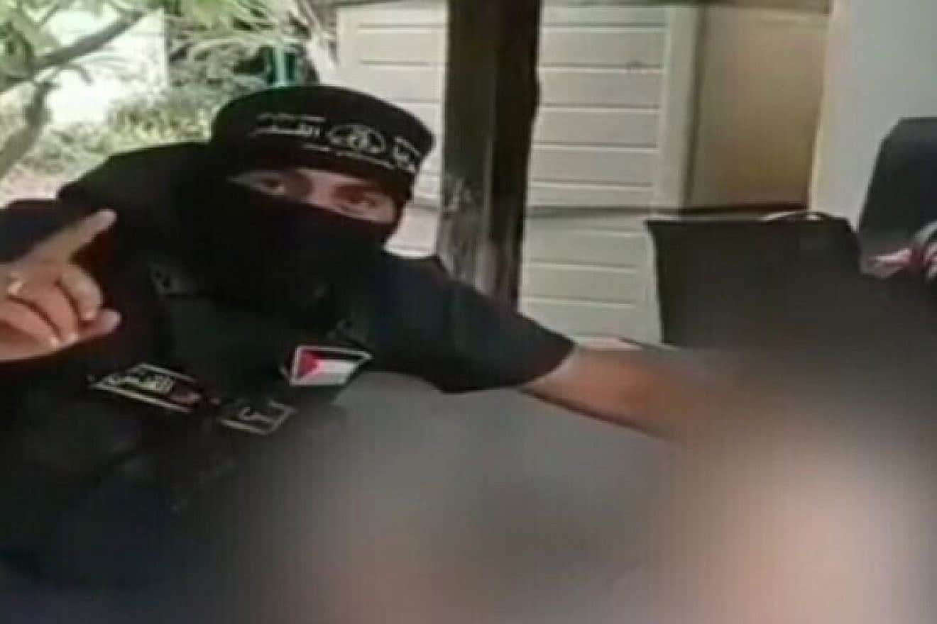 Hamas terrorists kidnapping civilians in southern Israel and taking them into the Gaza Strip, as seen in pixelated video from social media, Oct. 7, 2023. Source: "Channel 12" Screenshot.