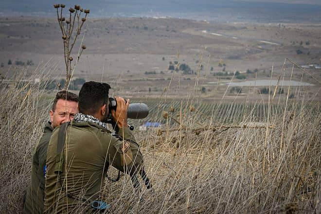 Israeli soldiers watch the Syrian side of the border in the Golan Heights in northern Israel on Oct. 30, 2023. Photo by Michael Giladi/Flash90.