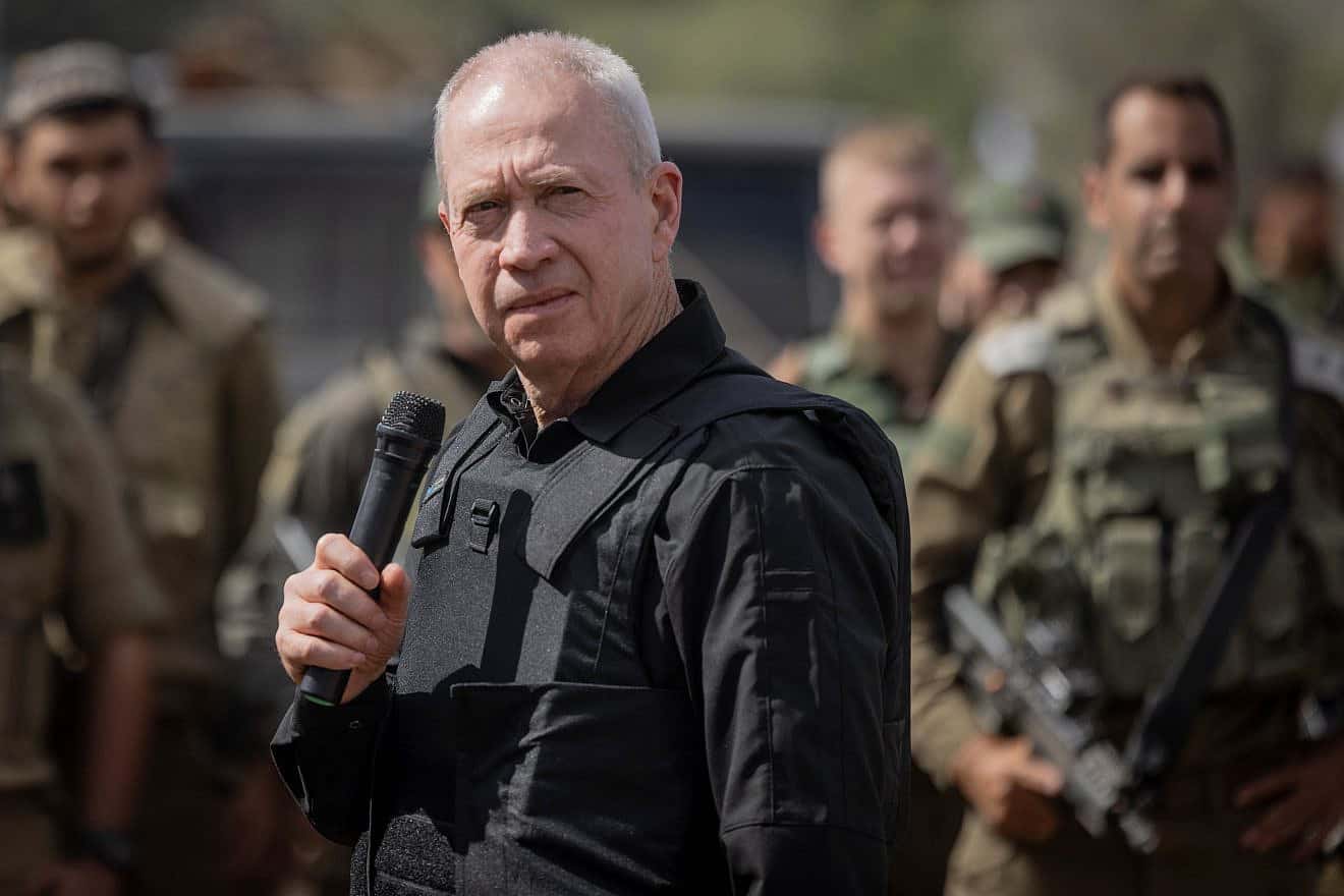 Israeli Defense Minister Yoav Gallant speaks with Israeli soldiers at a staging area not far from the border with the Gaza Strip, Oct. 19, 2023. Photo by Chaim Goldberg/Flash90.