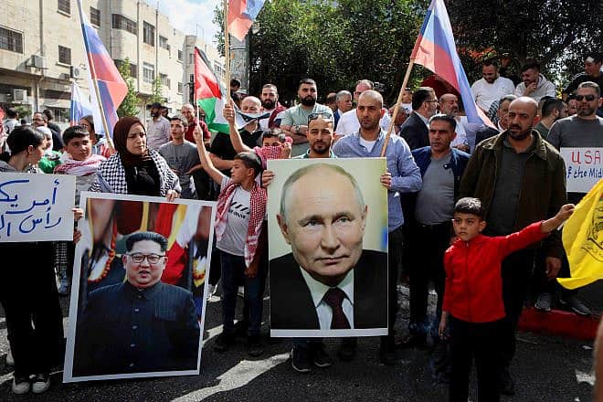 Palestinians in Hebron protest on behalf of their brethren in the Gaza Strip, with posters of Russian President Vladimir Putin and North Korean leader Kim Jong-un, following Hamas's Oct. 7 massacre of Israelis, Oct. 20, 2023. Photo by Wisam Hashlamoun/Flash90.