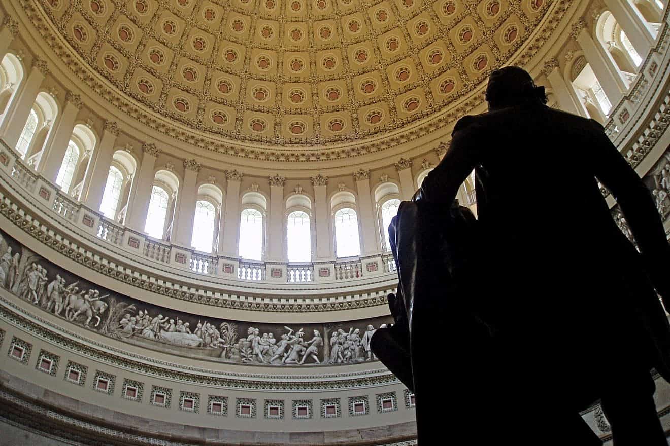 The interior of the U.S. Capitol rotunda from behind a statue of founding father and first president George Washington. The image captures a portion of Constantino Brumidi's “Frieze of American History” starting from “Pizarro Going to Peru” to the beginning of “Landing of the Pilgrims.” Credit: Matt Wade Photography via Wikimedia Commons.