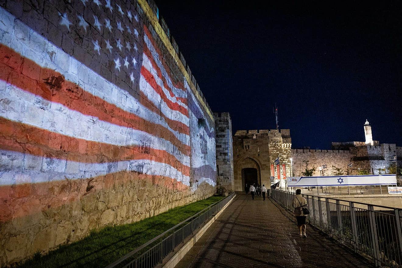 The American and Israeli flags are screened on the walls of Jerusalem's Old City to thank U.S. President Joe Biden for his support of Israel, on Oct. 18, 2023. Photo by Yonatan Sindel/Flash90.