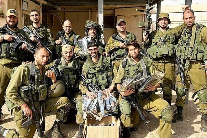 IDF soldiers receive protective equipment from One People, a civilian group that formed shortly after Hamas's Oct. 7 attack on Israel. Photo courtesy of One People.