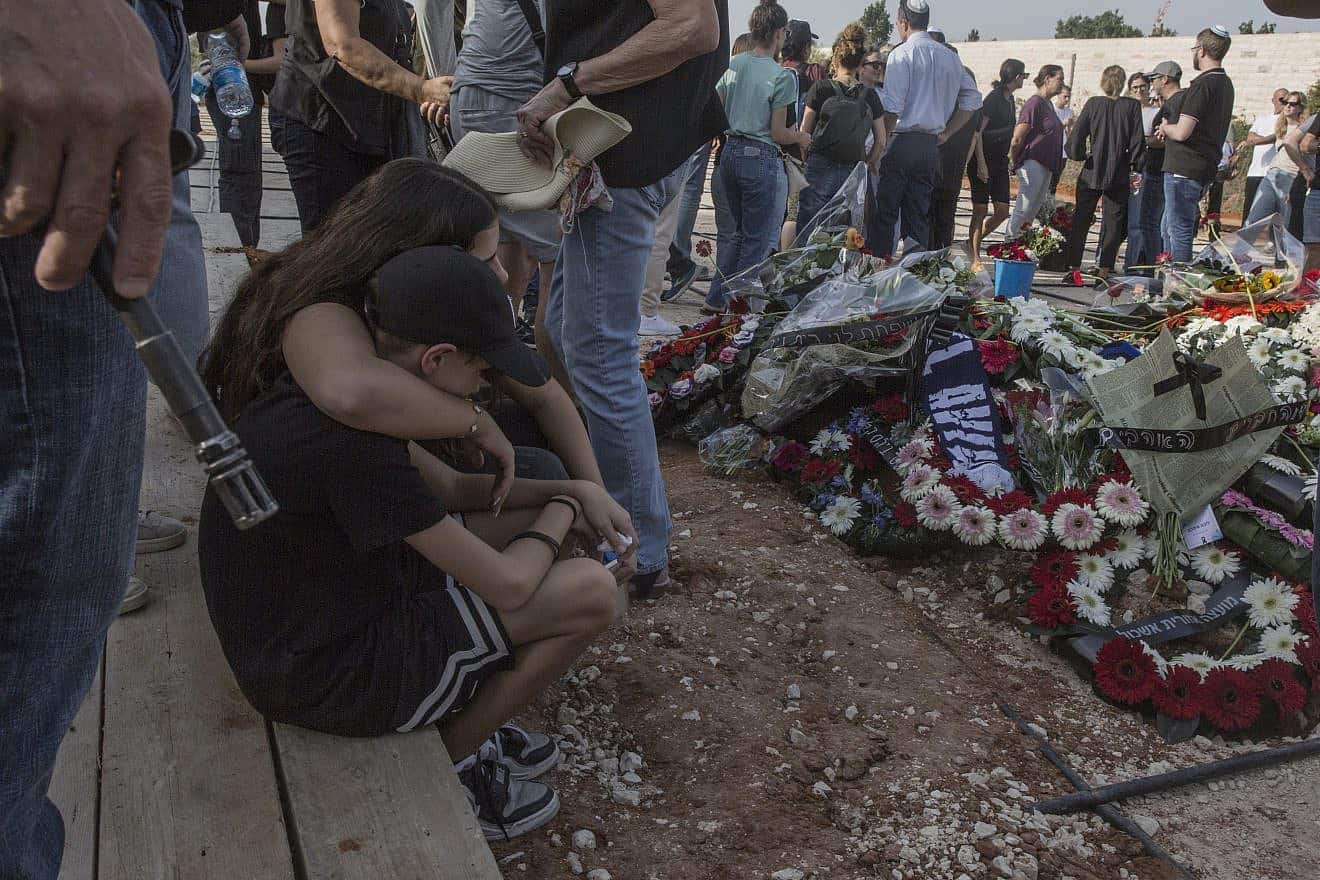 Members of the Cohen family mourn at a cemetery near Petach Tikvah, on Oct. 22, 2023. Three generations of the family were murdered by Hamas terrorists in Kibbutz Be'eri in southern Israel on Oct. 7, 2023. Photo by Rina Castelnuovo.