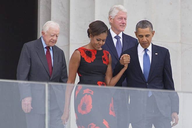 (From left) Former President Jimmy Carter, then-first lady Michelle Obama, former President Bill Clinton, and then-President Barack Obama at the 50th anniversary of the March on Washington for Jobs and Freedom Aug. 28, 2013. Credit: Joseph Sohm/Shutterstock.