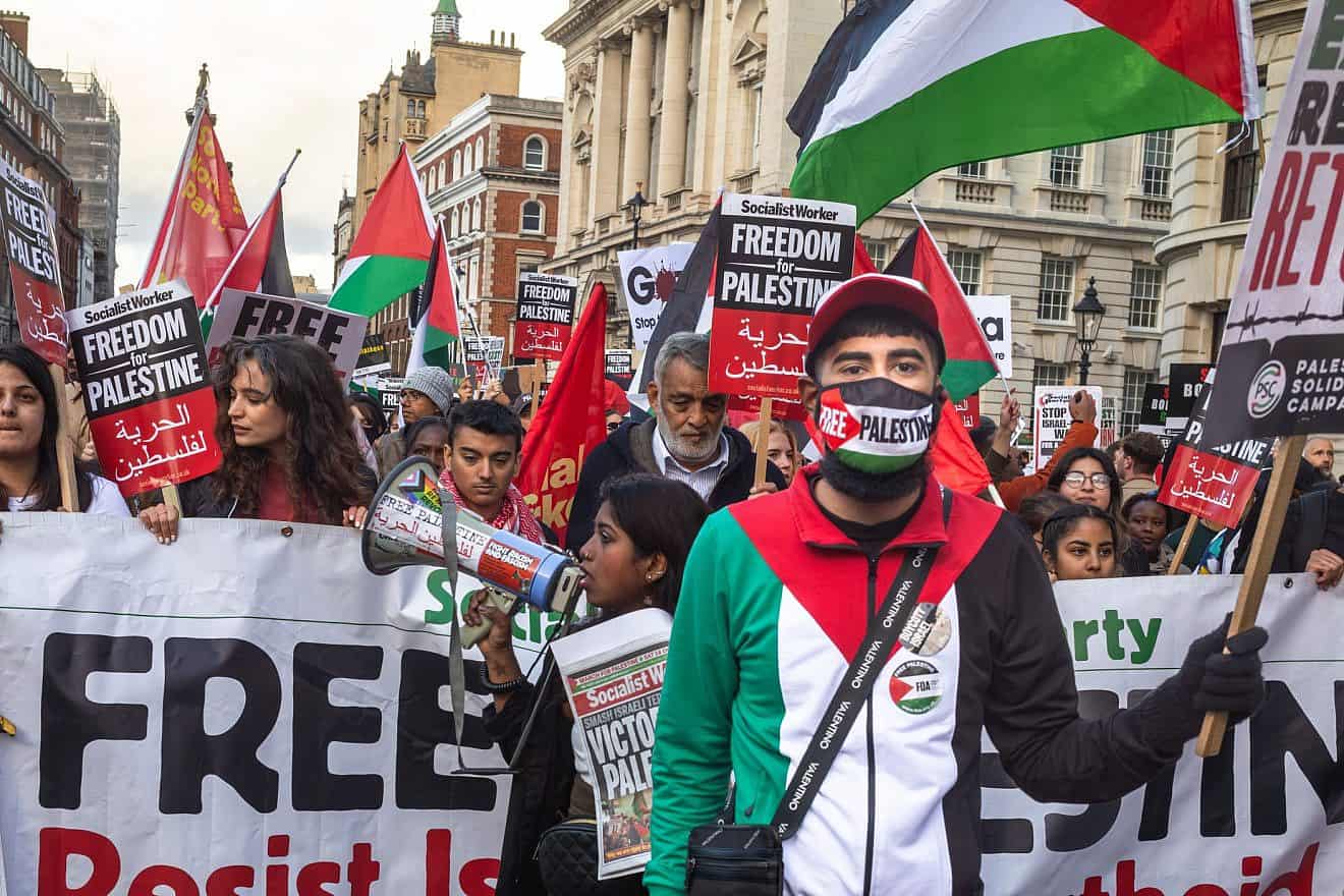 Anti-Israel and pro-Palestinian demonstrators march through central London in support of the Hamas terrorist group, Oct. 14, 2023. Credit: Andy Soloman/Shutterstock