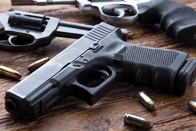 Guns and ammunition. Credit: Kiattipong/Shutterstock