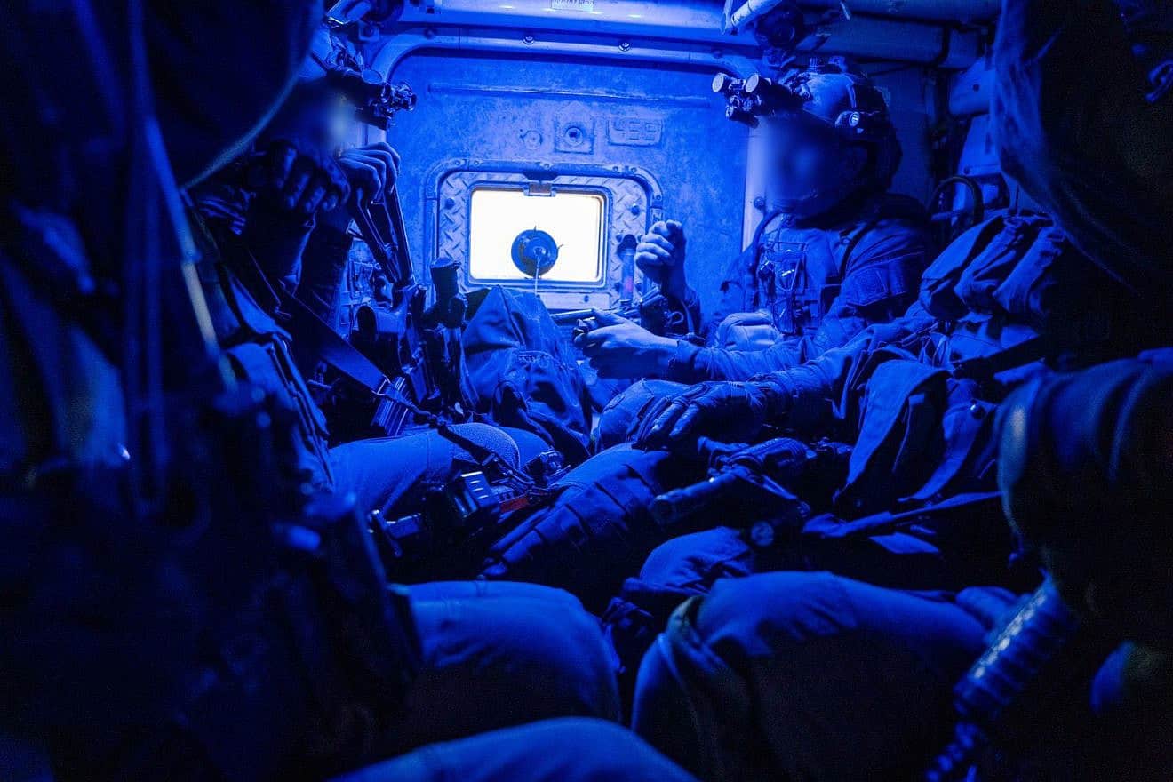 Israeli troops in an armored personnel carrier operating in the Hamas-ruled Gaza Strip, Nov. 15, 2023. Credit: IDF.