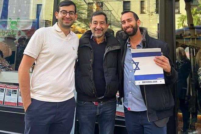 Owner Aaron Dahan (left) with customers outside Caffè Aronne on Manhattan's Upper East Side, November 2023. Credit: Courtesy.