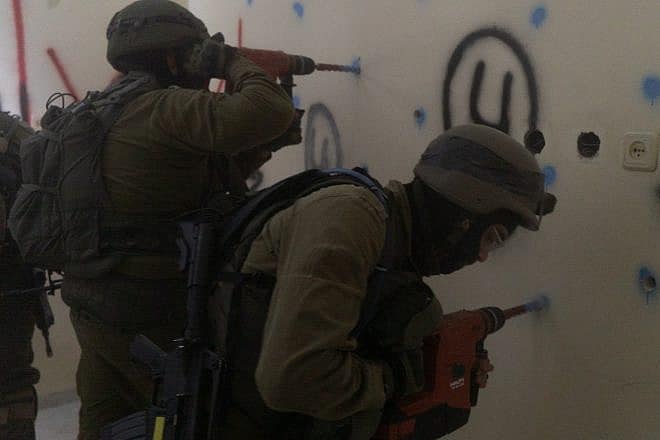 Israeli forces preparing for demolition the home of one of the Hamas terrorists responsible for the June shooting attack that killed four Israelis near Eli, Nov. 14, 2023. Credit: IDF.