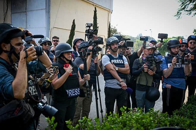 Journalists tour Kibbutz Kfar Aza near the Israel-Gaza border, Nov. 2, 2023. Photo by Arie Leib Abrams/Flash90.