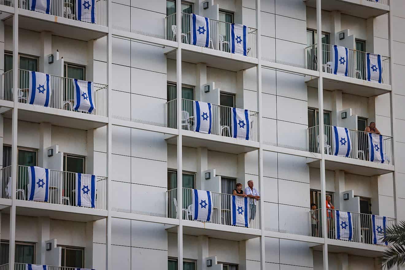 Balconies with Israeli flags in a hotel in the Dead Sea in southern Israel, Nov. 9, 2023. Photo by Chaim Goldberg/Flash90.