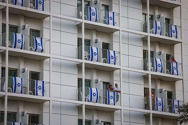 Balconies with Israeli flags in a hotel in the Dead Sea in southern Israel, Nov. 9, 2023. Photo by Chaim Goldberg/Flash90.