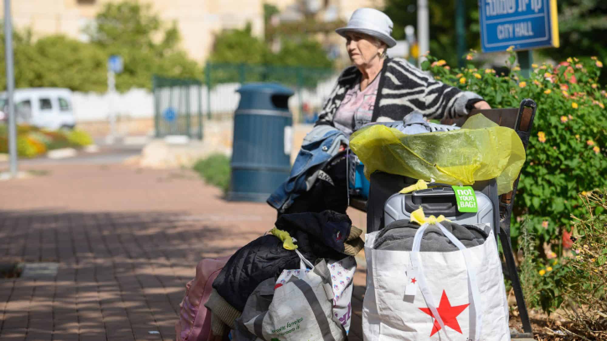 An Israeli prepares to be evacuated form Kiryat Shmona because of the attacks from Lebanon. Oct. 22, 2023. Photo by Ayal Margolin/Flash90.