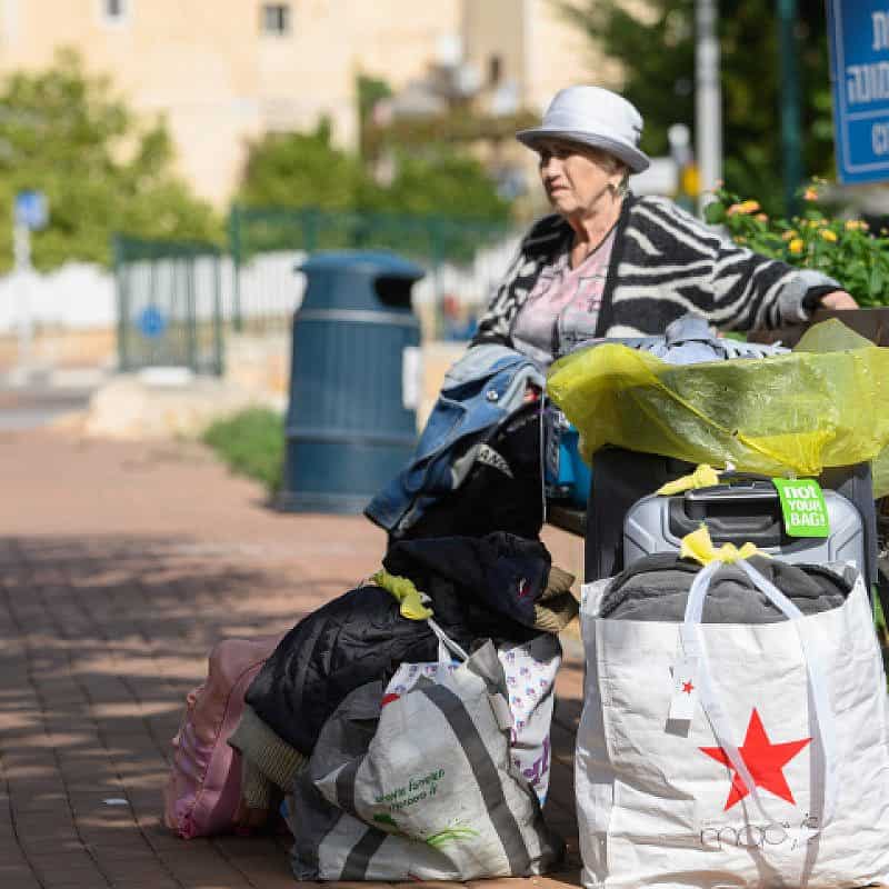 An Israeli prepares to be evacuated form Kiryat Shmona because of the attacks from Lebanon. Oct. 22, 2023. Photo by Ayal Margolin/Flash90.