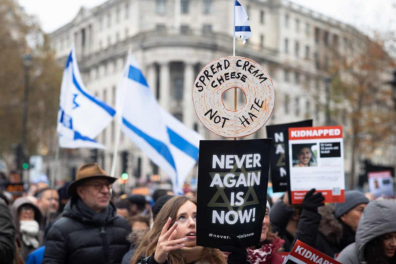 Israel supporters at the “March Against Antisemitism” in London hold flags and placards in support of hostages taken by Hamas to Gaza, Nov. 26, 2023. Photo by Andy Soloman/Shutterstock.