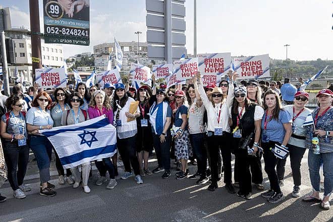 Momentum women join the families of captives in Gaza marching in Modi'in for their release, Nov. 16, 2023. Photo by Aviram Waldman.