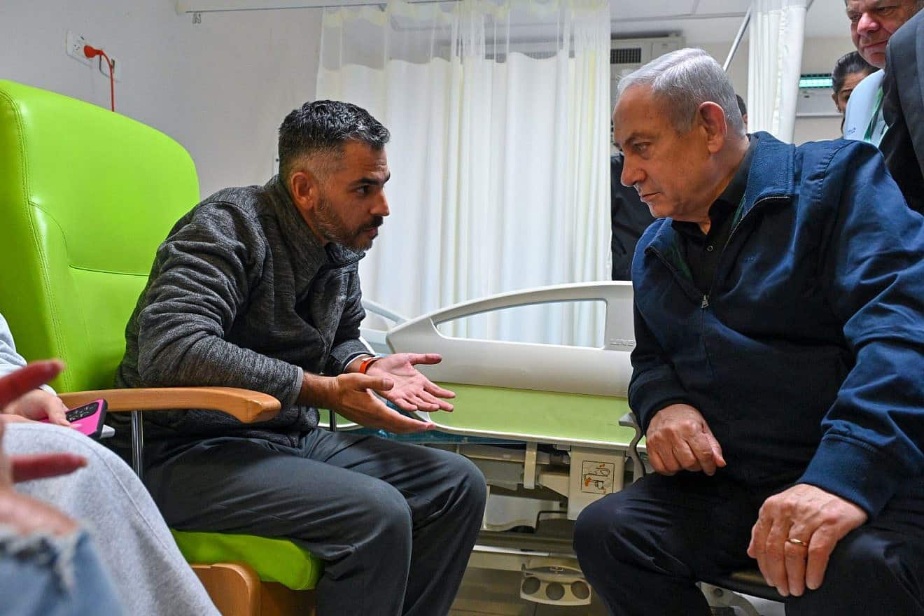 Israeli Prime Minister Benjamin Netanyahu meets at Soroka Medical Center in Beersheva with IDF soldiers and Israeli police officers injured on Oct. 7 during the fighting with Hamas terrorists who infiltrated the border and attacked communities in southern Israel, Nov. 29, 2023. Credit: Kobi Gideon/GPO.