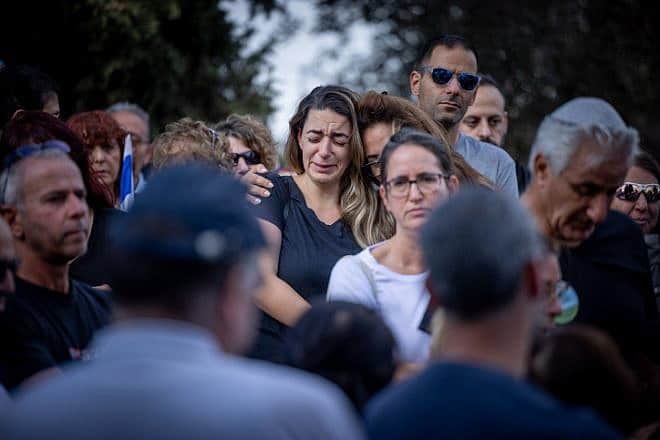 Mourners attend the funeral at Kibbutz Beit Guvrin on Tuesday of Yosef Vahab, whom Hamas terrorists murdered in Kibbutz Nir Oz on Oct. 7. Photo by Yonatan Sindel/Flash90.