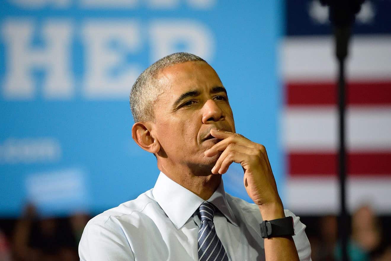 Former U.S. President Barack Obama listens to a speech by Hillary Clinton at the Charlotte Convention Center in Charlotte, N.C., on July 5, 2016. Credit: Evan El-Amin/Shutterstock.