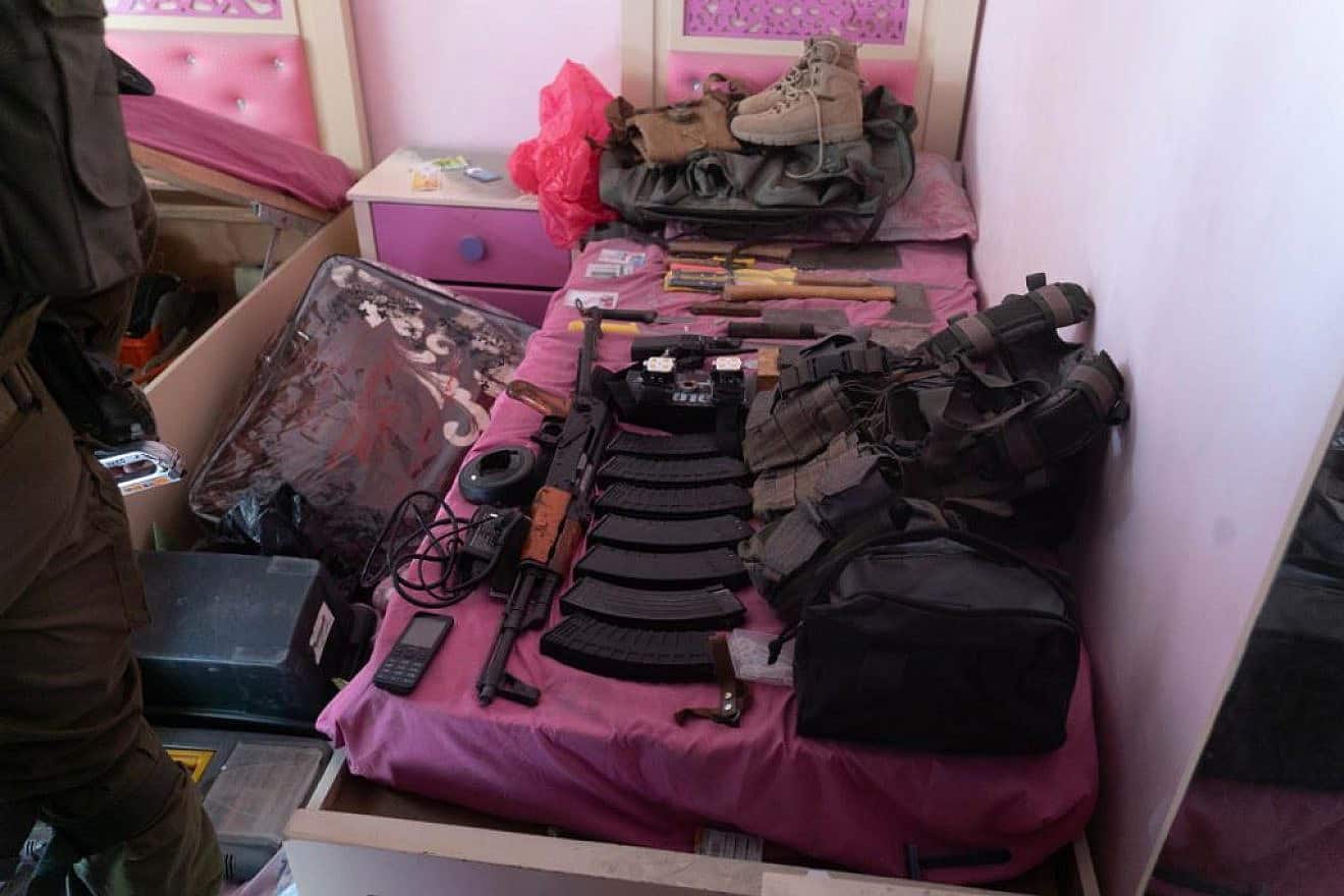 Weapons found under children's beds in Jabalia, north of Gaza City, Nov. 2, 2023. Credit: IDF Spokesperson's Unit.