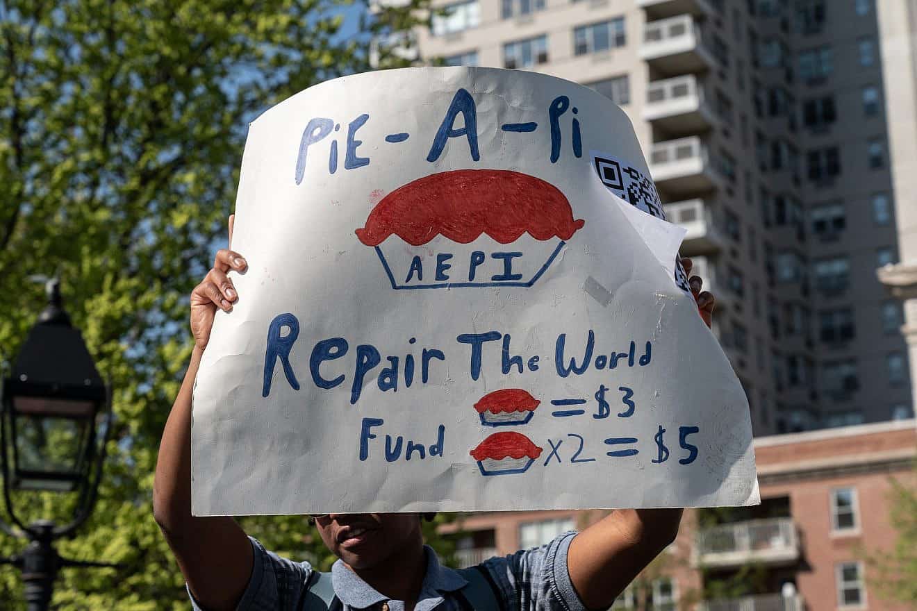 New York University's Alpha Epsilon Pi (AEPi) fraternity raises money for the "Repair the World" organization and a children's hospital in Israel by offering, for a small donation, to get a plate of whipped cream on the face in Washington Square Park, April 21, 2023. Credit: Lev Radin/Shutterstock.