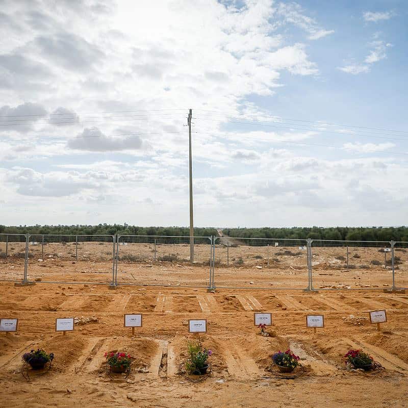 Graves of Israelis who were murdered by Hamas terrorists on Oct. 7 in Kibbutz Be'eri, Nov. 15, 2023. Photo by Chaim Goldberg/Flash90.