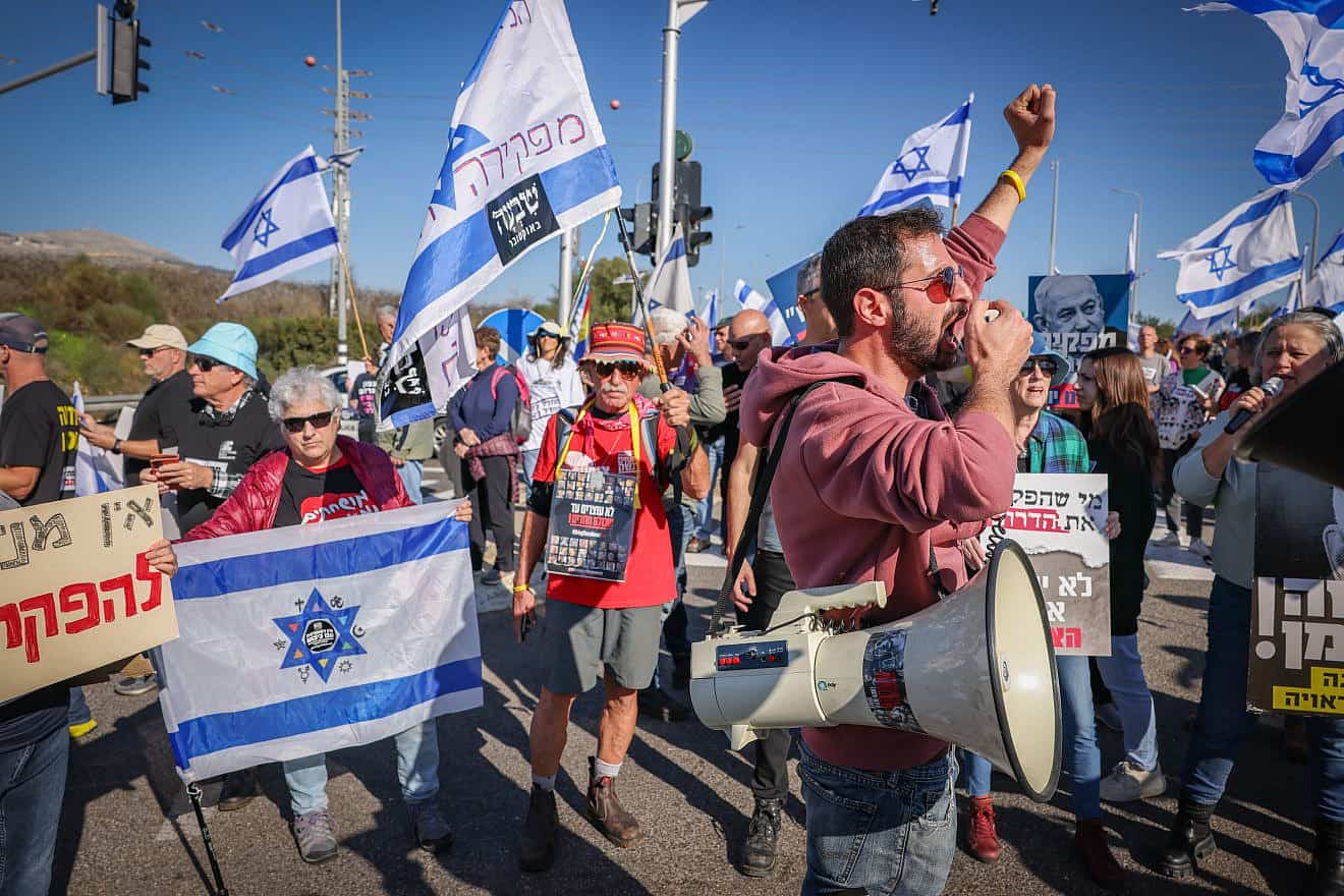 Residents and supporters of communities in northern Israel rally at the Amiad Junction in the Upper Galilee, calling for the government to better address their needs, Dec. 26, 2023. Photo by David Cohen/Flash90.