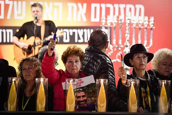 Families of Israelis still being held captive by Hamas terrorists in Gaza attend a candle-lighting ceremony on the first night of the Jewish holiday of Chanukah at Hostage Square in Tel Aviv on Dec. 7, 2023. Photo by Avshalom Sassoni/Flash90.
