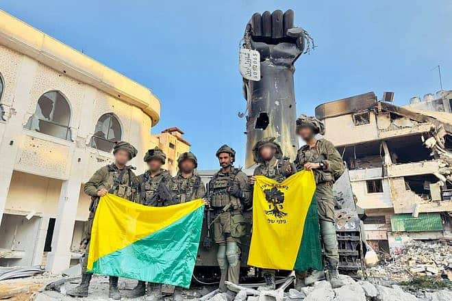 Israeli soldiers pictured just before demolishing a Hamas monument in "Palestine Square," the Shejaiya neighborhood of Gaza City, Dec. 18, 2023. Credit: IDF.