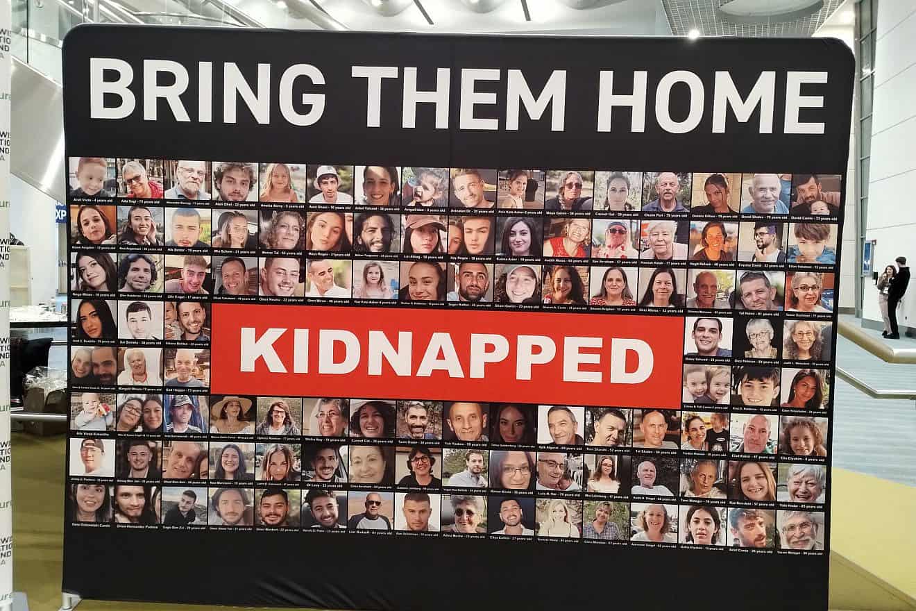 Photos of Israeli civilians kidnapped by Hamas terrorist on Oct. 7, and taken back into captivity in the Gaza Strip, on display at the Colorado Convention Center in downtown Denver, the site of the opening plenary of the Jewish National Fund-USA annual conference, Nov. 30, 2023. Photo by Carin M. Smilk.
