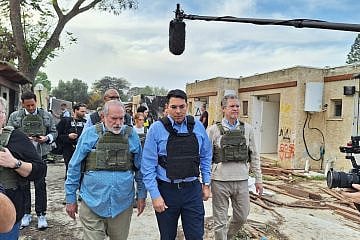 Former Arkansas Governor Mike Huckabee (left), MK Danny Danon (center) and former Kansas Governor Sam Brownback (right) at Kibbutz Kfar Aza, Dec. 20, 2023. 