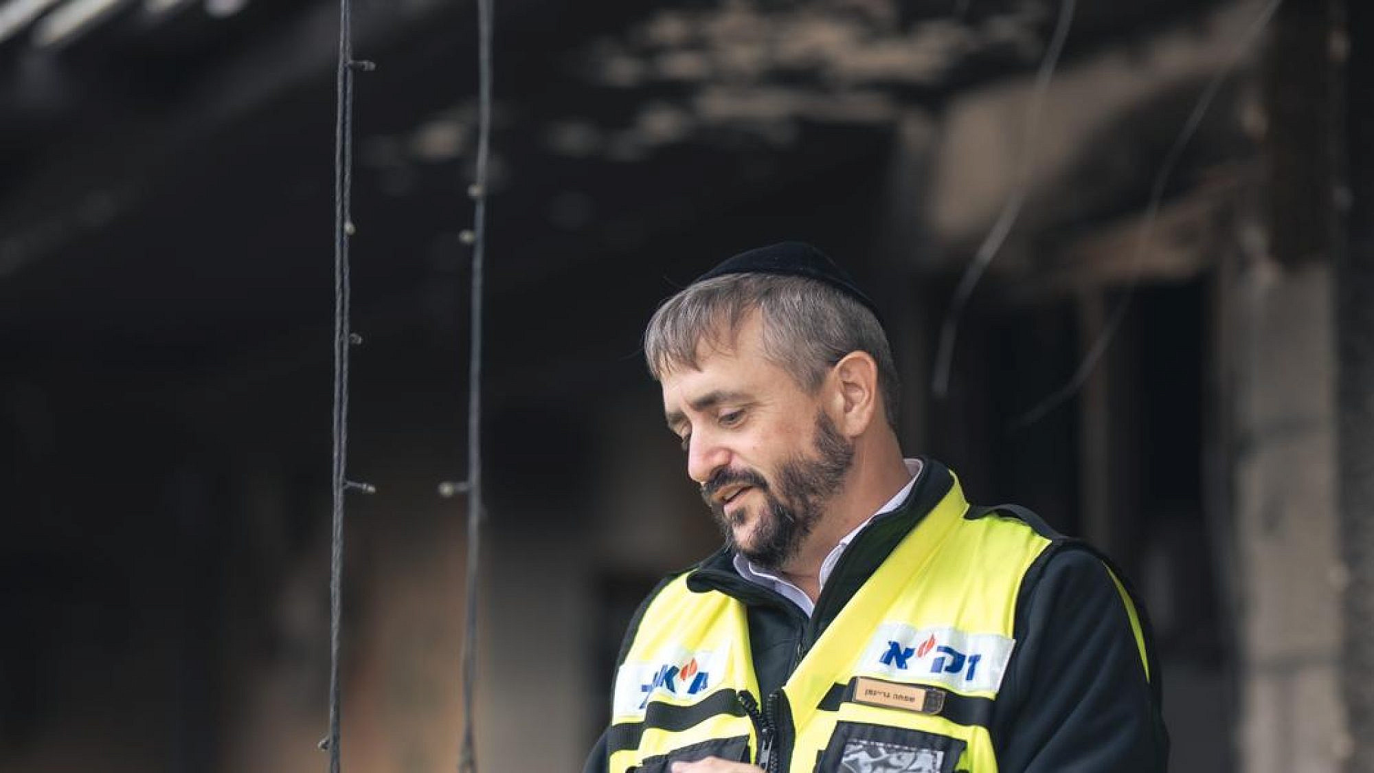 ZAKA volunteer Simcha Greiniman at the site of Hamas's Oct. 7 massacre. Photo courtesy of Simcha Greiniman.