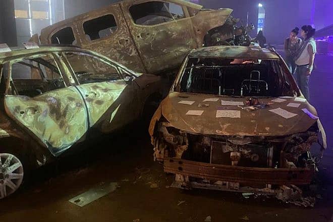 Burned-out cars recreate the scene of the Oct. 7 massacre. Photo by Amelie Botbol.