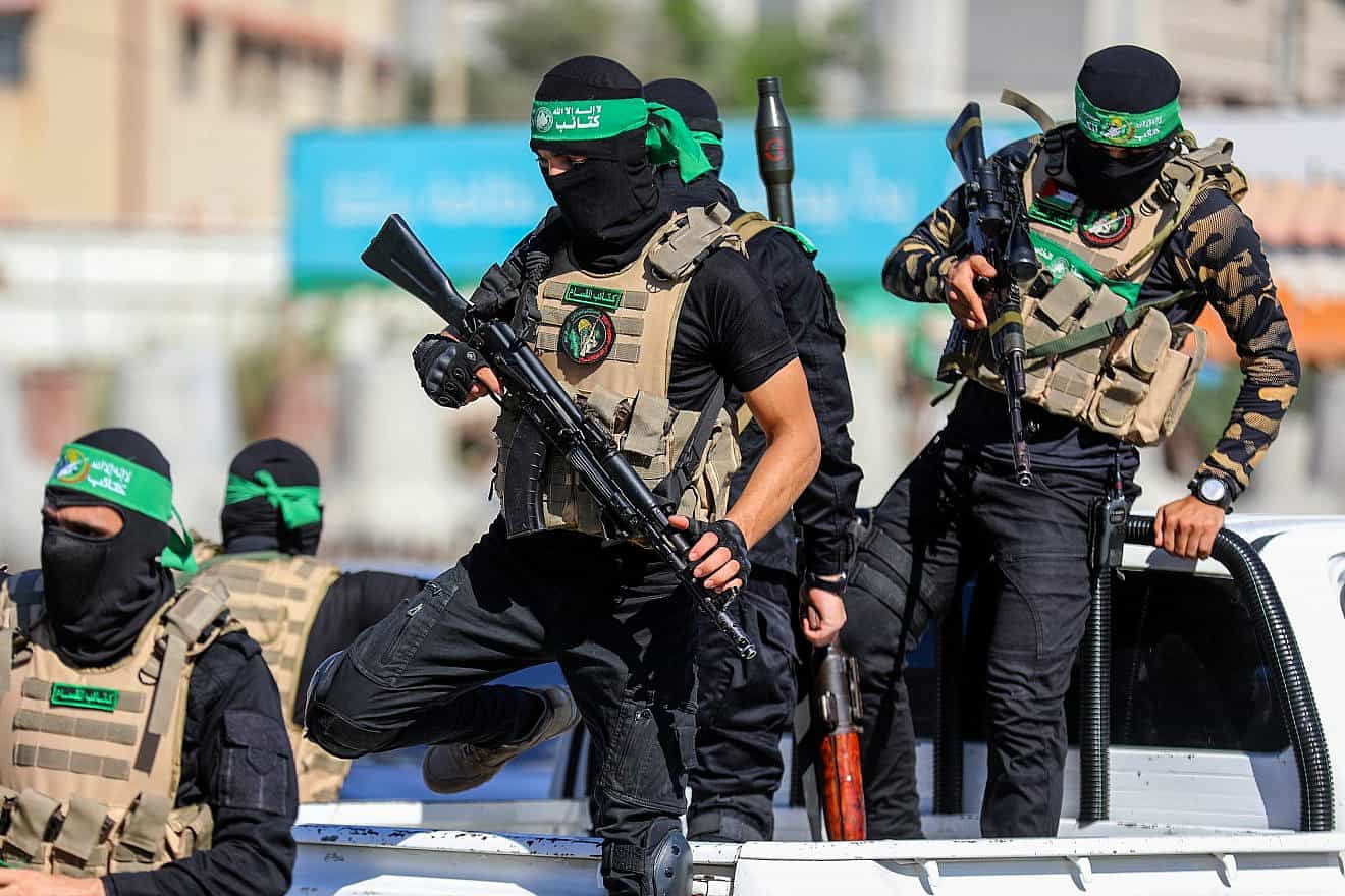 Hamas terrorists celebrate the eighth anniversary of kidnapping the corpse of Israeli soldier Shaul Aron, July 20, 2022. Photo by Anas-Mohammed/Shutterstock.