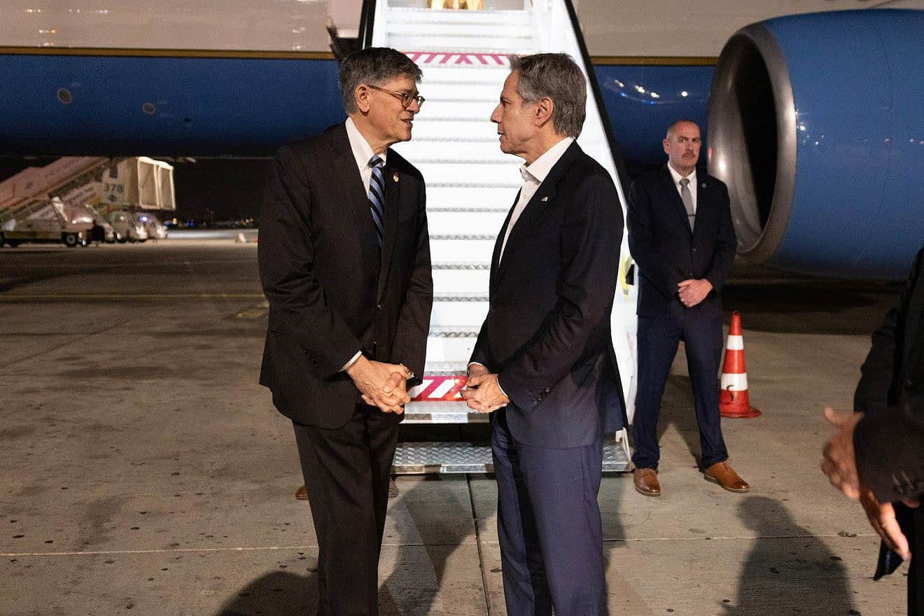 U.S. Secretary of State Antony Blinken (right foreground) is greeted by Jack Lew, U.S. ambassador to Israel, in Tel Aviv on Jan. 9, 2024. Credit: Chuck Kennedy/State Department.