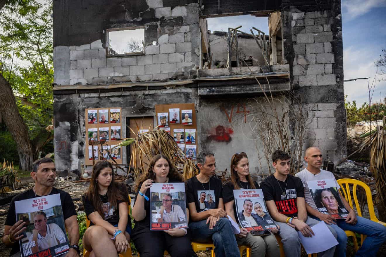 Freed hostage Ofir Engel and families of Israelis still being held by Hamas terrorists in the Gaza Strip attend a press conference for the foreign media at Kibbutz Be'eri, Dec. 20, 2023. Photo by Yonatan Sindel/Flash90.