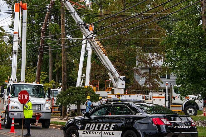 Utility workers in Cherry Hill, N.J. Credit: Alan Budman/Shutterstock.