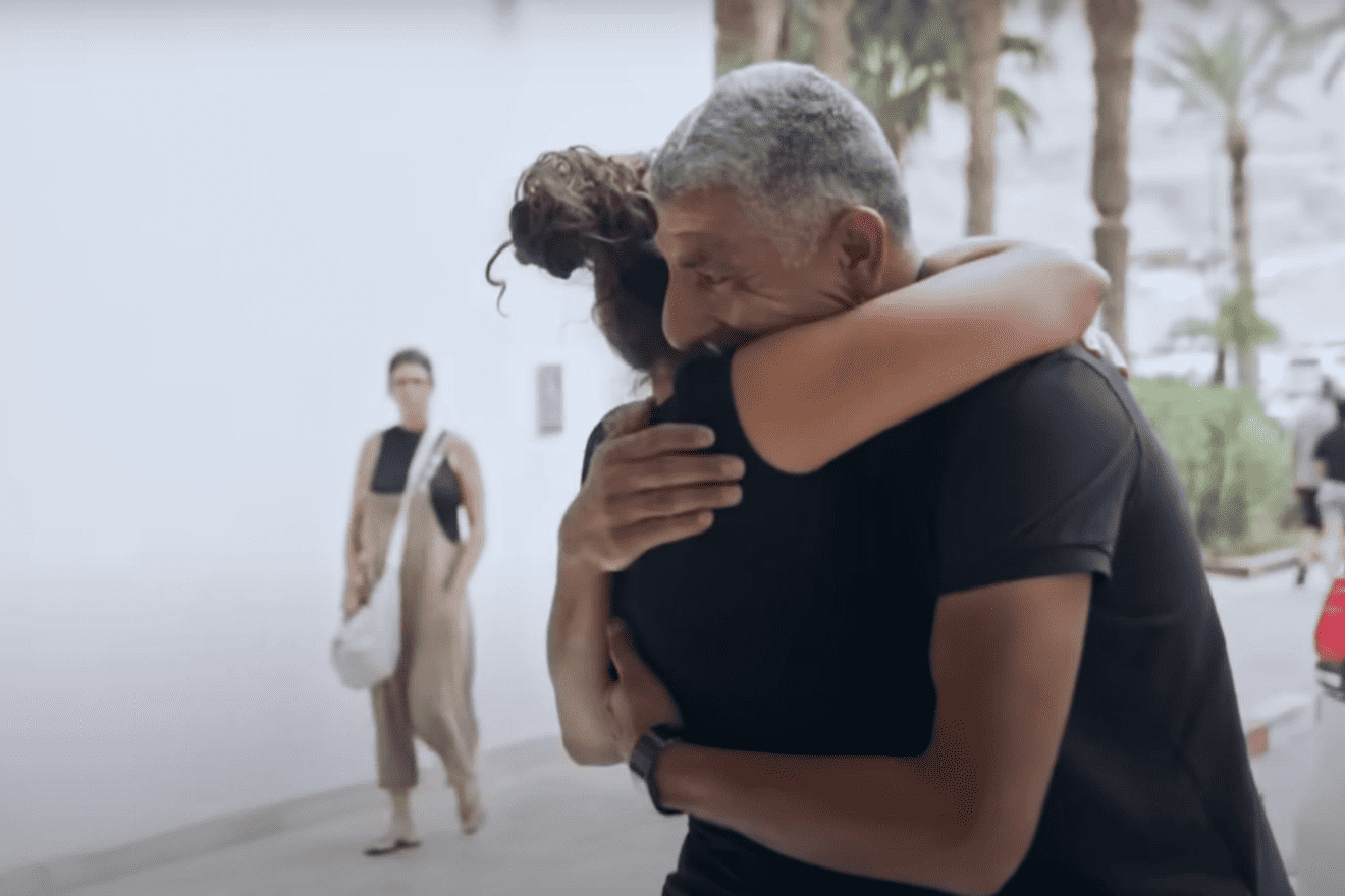 Kibbutz Be’eri resident Aya Meydan hugs one of the Bedouin rescuers who saved her from Hamas terrorists on Oct. 7, 2023. Source: Screenshot/Partners in Fate.