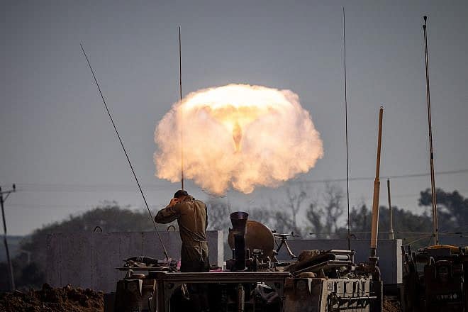 Israeli soldiers fire mortar shells towards targets in the Gaza Strip on Jan. 1, 2024. Photo by Chaim Goldberg/Flash90.