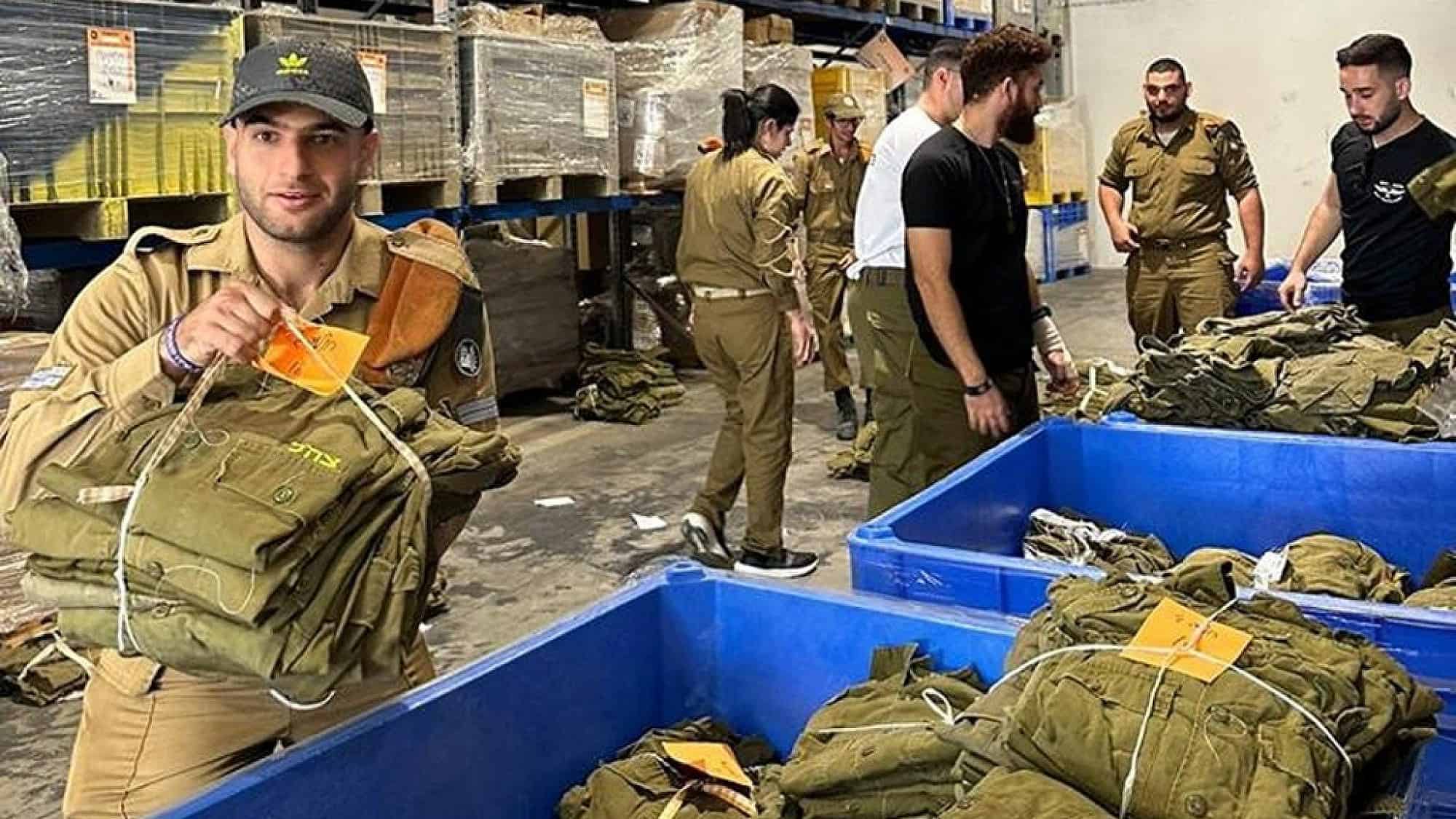 IDF soldiers with special needs pack equipment at a logistics center in Ramle. Credit: Special in Uniform.